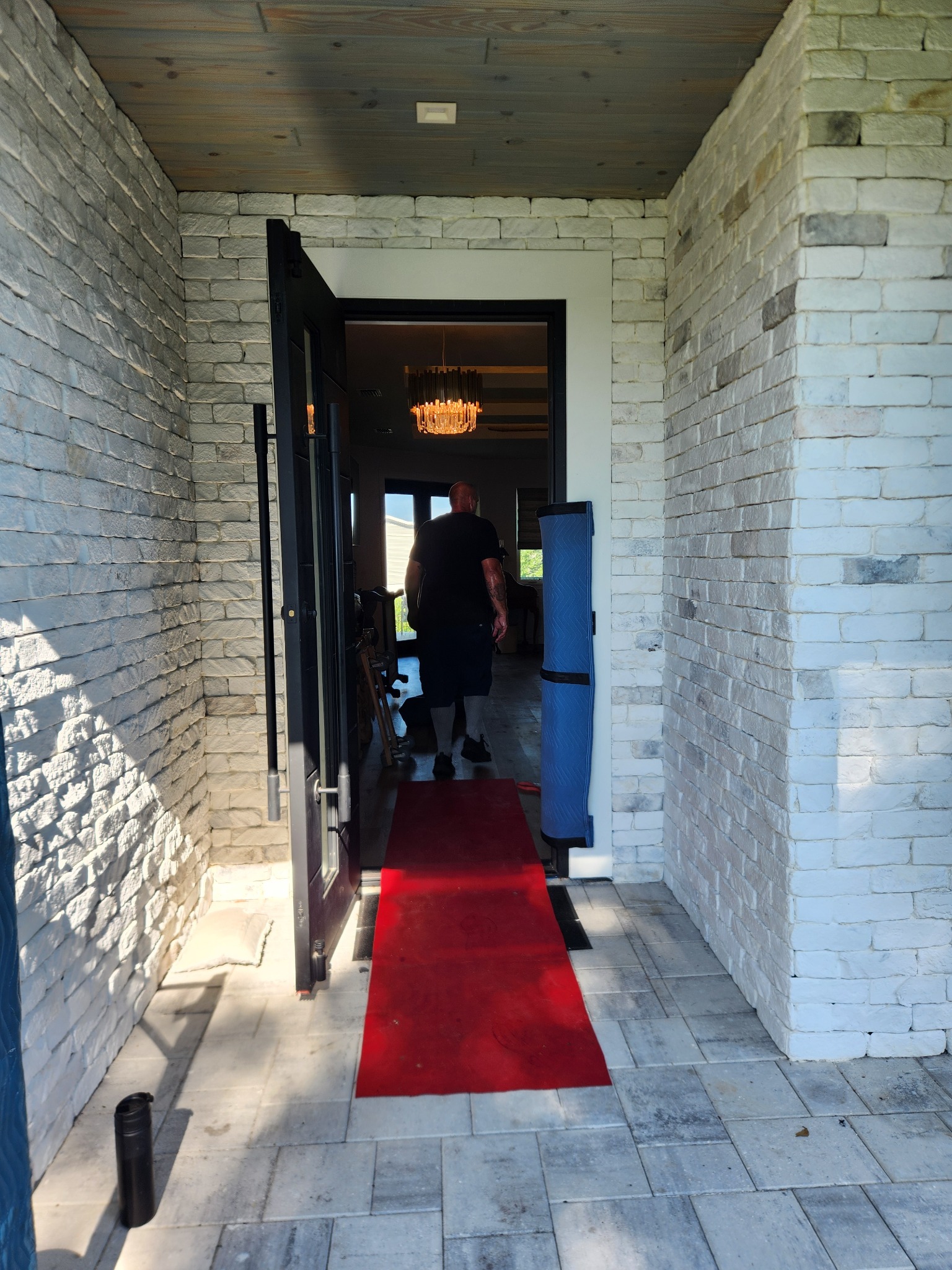 Home entryway protected with a floor runner during a Triton Moving job
