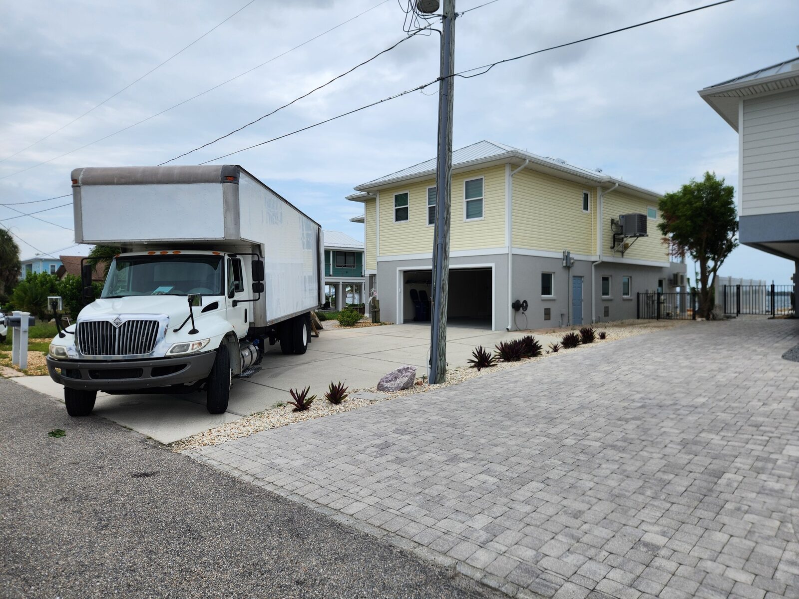 Triton Moving truck at a coastal Southwest Florida home