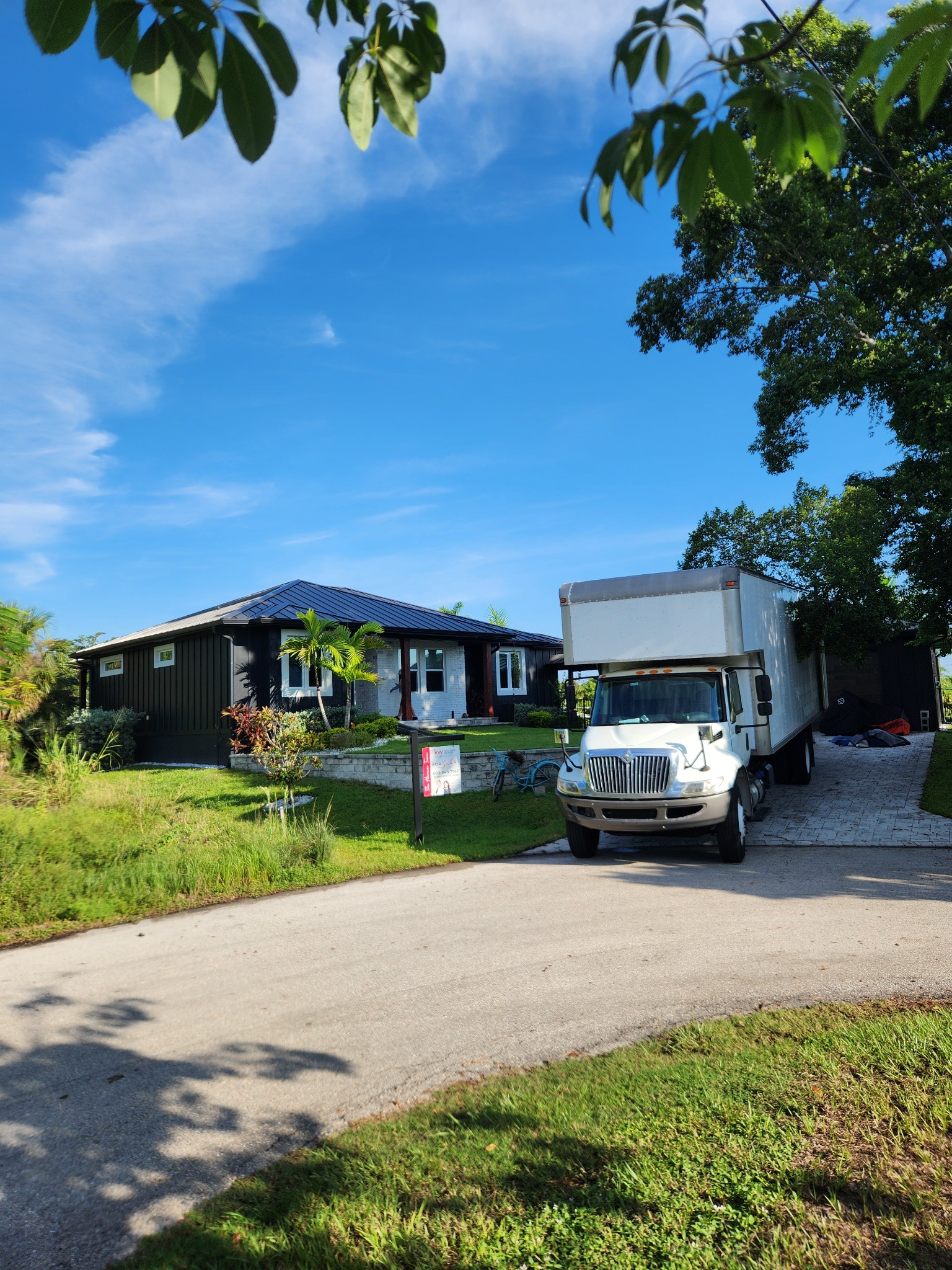 Triton Moving truck ready for service in a Florida neighborhood