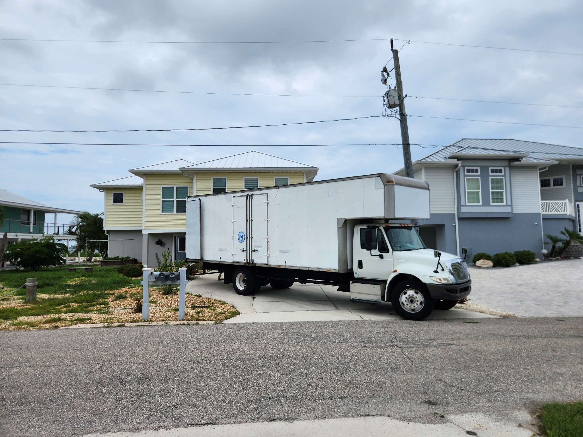 Triton Moving truck parked at a Southwest Florida residential moving job