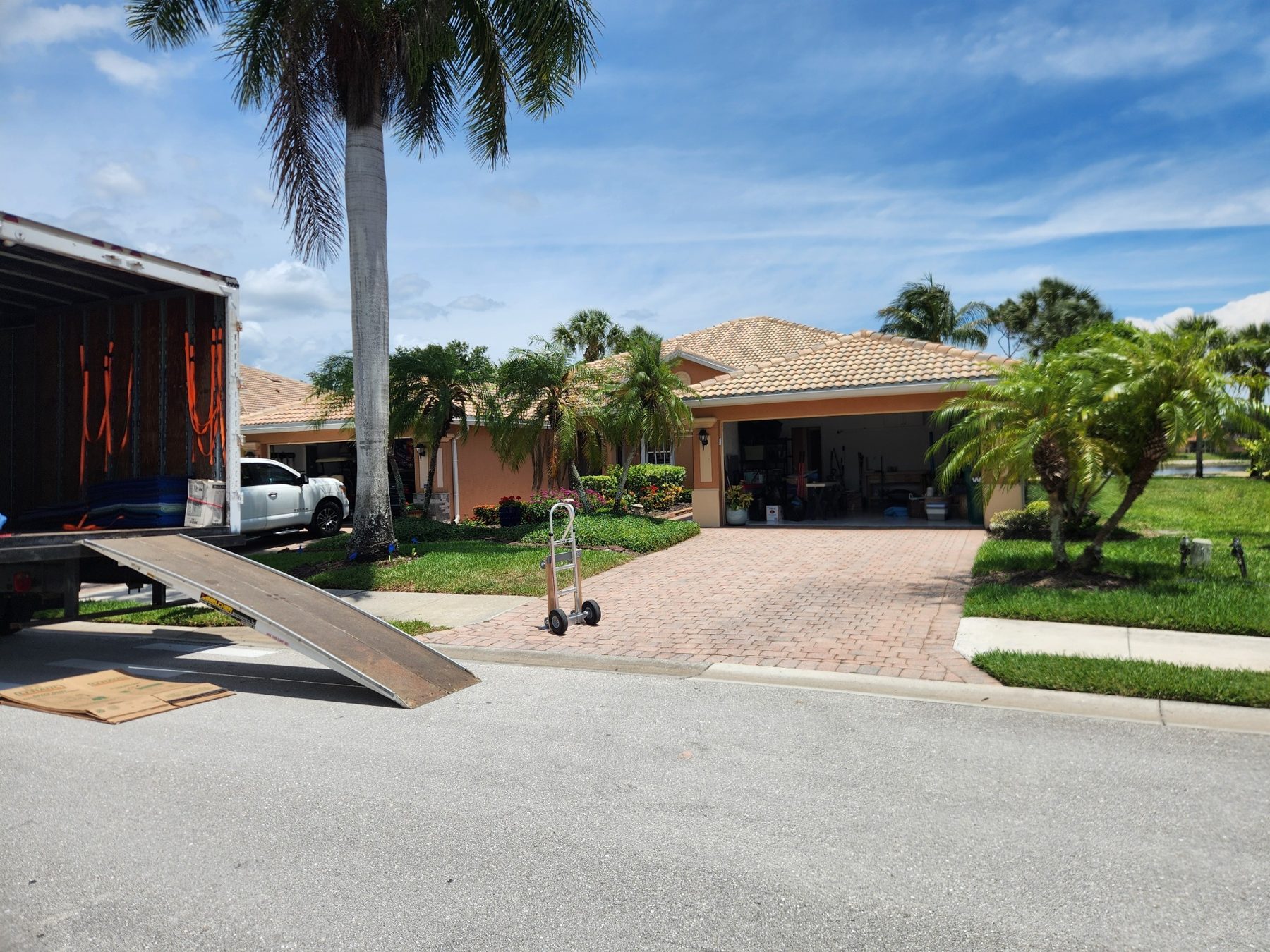 Moving truck ramp set up in a Florida neighborhood