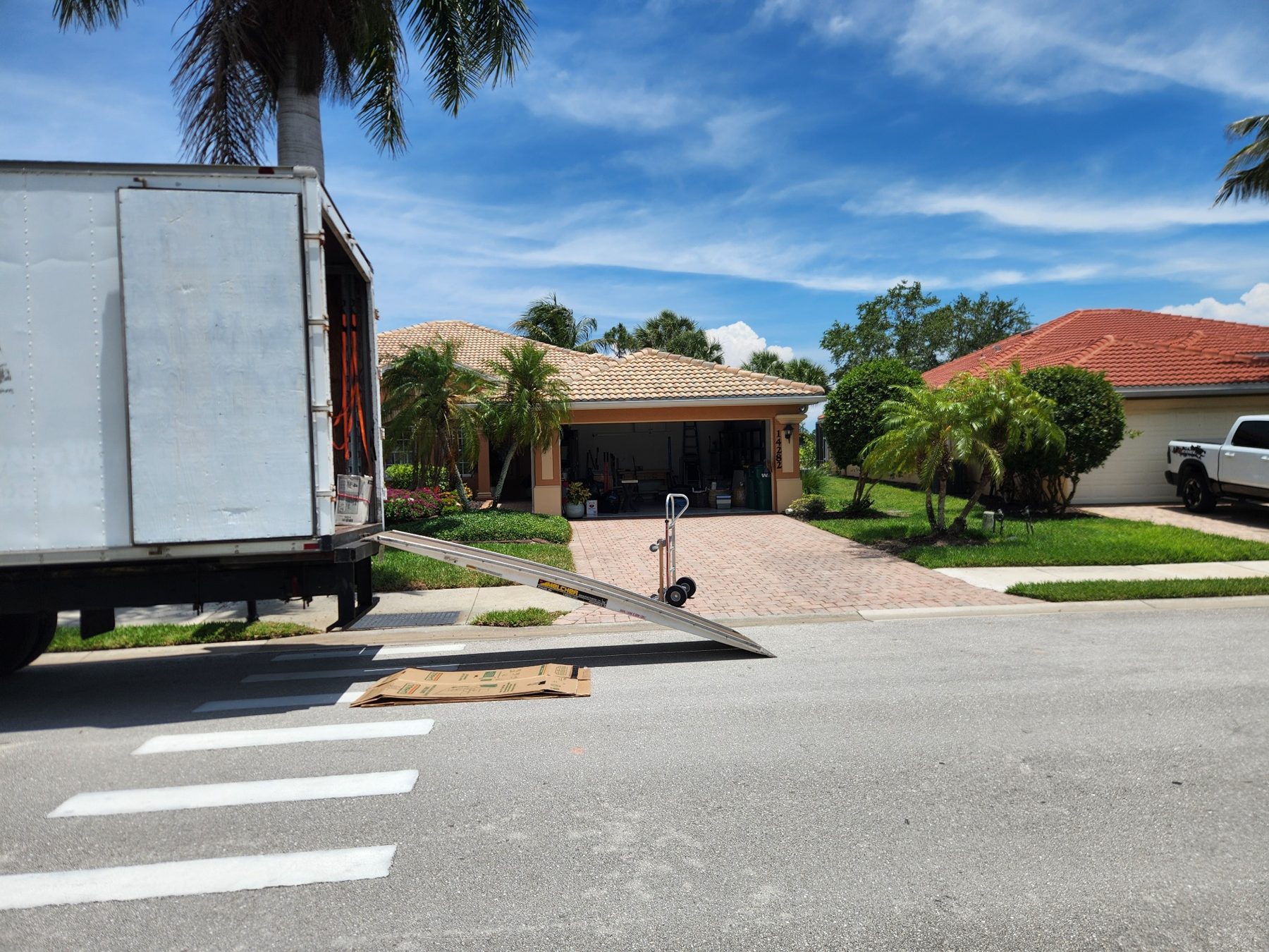 Professional moving truck and ramp ready for a residential move